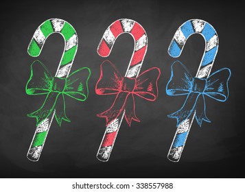 Collection of color chalkboard drawings of Christmas candy cane with bow.