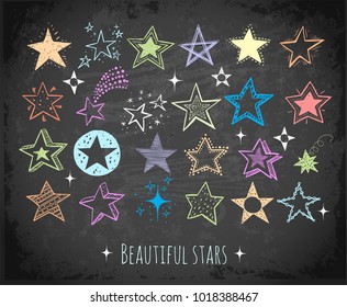 Collection of colored doodle stars on blackboard background