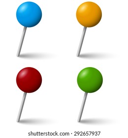 collection of colored pin needles with shadow