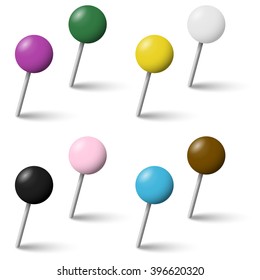 collection of colored pin needles with shadow