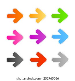 Collection of colorful arrowhead stickers / buttons isolated on white