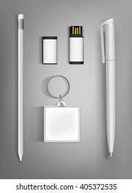 Collection of corporate identity presentation templates mock up with a pencil, pen, flash drive and  key ring. Ready for your design on gray background.