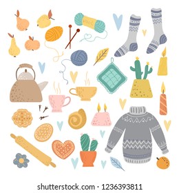 A collection of cozy things on a white background. Tea and gingerbread, kitchen, knitting, cold season