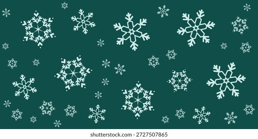 Uma coleção de delicados flocos de neve brancos de vários tamanhos espalhados por um fundo verde escuro, criando uma cena festiva de inverno.