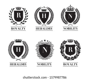 Collection of the Different black and gold silhouette shields, wreaths and crowns depicting an award, achievement, heraldry, nobility. 