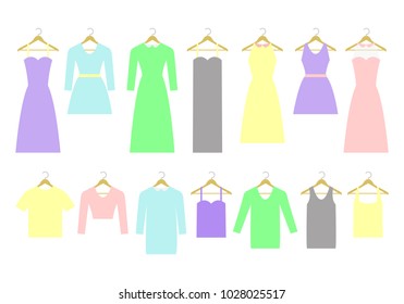 Collection of different dresses and shirts on hangers. Fashion women's wardrobe