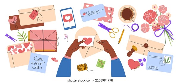 Collection of different envelopes, postmarks, postcards. Romantic, love style. Woman hands creating Valentine's day card and put it on the envelope. Set of stationery for hand made creation.