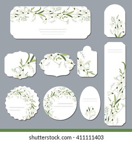 Collection with different floral paper labels for  announcements. Round,square,rectangular, different shapes.White primrose flowers. Snowdrops.