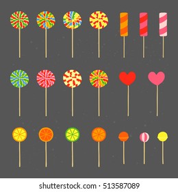 Collection of different hand drawn colorful lollipops isolated on chalkboard background.
