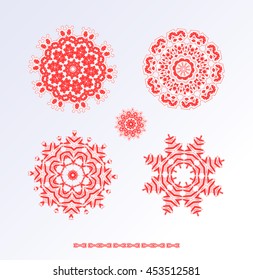 Collection of different red snowflakes on white background