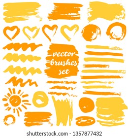 Collection of dirty elements for design. Large set of two-color strokes, brushes, dots, inks, strokes and lines. Vector illustration isolated on white background. Yellow shades