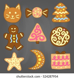 Collection of doodle cute colorful cookies with icing isolated on chalkboard background.