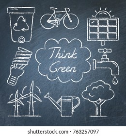 Collection of ecology icons on chalkboard. Think green lettering. Renewable energy, ecology transport and other symbols in sketch style.