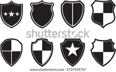 A collection of eight black and white shield vector icons, featuring various designs including plain, star-emblazoned, and quartered patterns, suitable for security or protection themes.