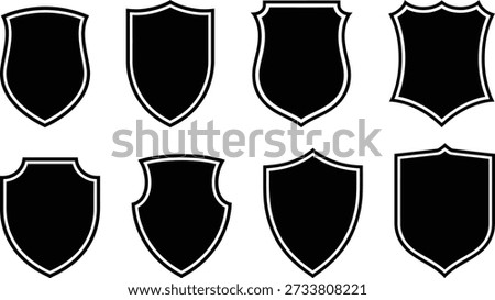 A collection of eight distinct shield shapes with unique designs and outlines.