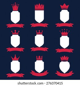 Collection of empire design elements. Heraldic royal coronet illustration. Set of luxury vector shields with king crown and undulate festive ribbon. 