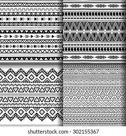 Collection of ethnic seamless patterns. Set of black and white backgrounds handmade. Vector illustration. Geometric striped elements.