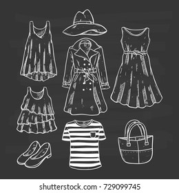 collection of fashionable female clothing with hand drawn or sketch style on chalkboard background