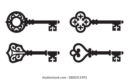Collection of four different vintage antique key silhouettes with ornate details on white background