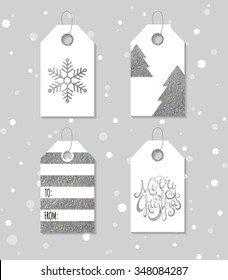 Collection of four silver texture Christmas and New Year gift tags. Set of festive gift tag, sticker, label. Template for banner, invitation, postcard, card, wrapping, packaging. Vector illustration.