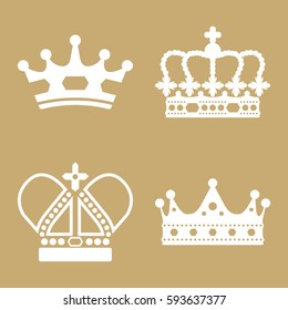 A collection of four simple vector crowns isolated on a flat color background.