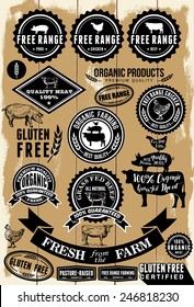 A collection of free range and organic labels on wooden background . All labels are grouped. EPS 8