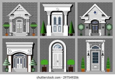 collection of front doors on gray brick wall