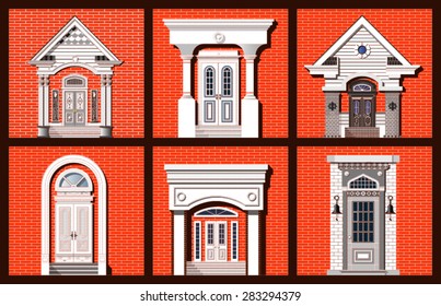 collection of front doors on red brick wall