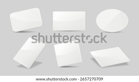 Collection of glossy blank white cards with different shapes and angles, minimal style on gray background. Concept of templates and mockups. Vector illustration