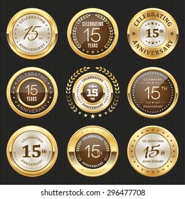 Collection of glossy gold 15th anniversary badge