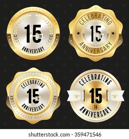 Collection of glossy gold 15th anniversary badges