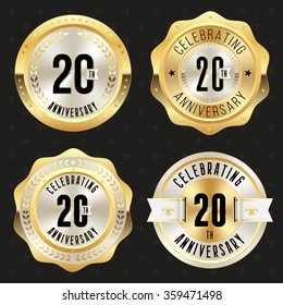 Collection of glossy gold 20th anniversary badges