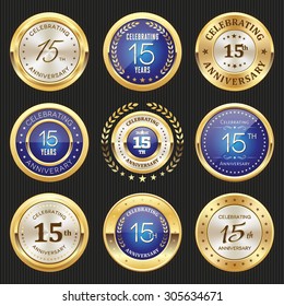 Collection of glossy gold and blue 15th anniversary badges