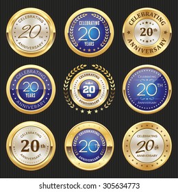 Collection of glossy gold and blue 20th anniversary badges