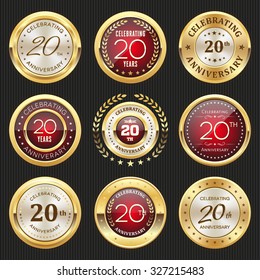 Collection of glossy gold and red 20th anniversary badges