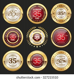 Collection of glossy gold and red 35th anniversary badges