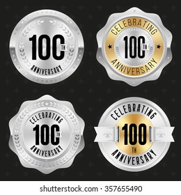 Collection of glossy silver 100th anniversary badges