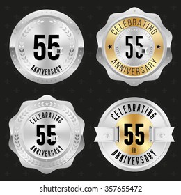 Collection of glossy silver 55th anniversary badges