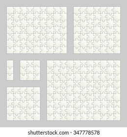 collection of gray puzzles with different number of parts