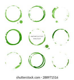 Collection of green watercolor round stains and blots on white background