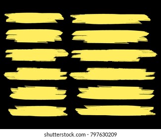 Collection of hand drawn golden grunge brushes. Vector Grunge Brushes. Dirty Artistic Design Elements. Creative Design Elements. Dark background. Distress Frame, Logo, Banner, Wallpaper.