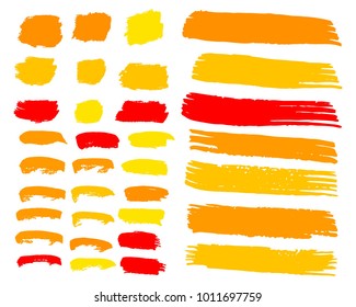 Collection of hand drawn golden, red grunge brushes. Vector Grunge Brushes. Dirty Artistic Design Elements. Creative Design Elements. White background. Distress Frame, Logo, Banner, Wallpaper.