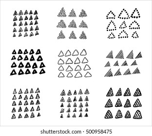 Collection of hand drawn triangles. Set of black and white geometric elements