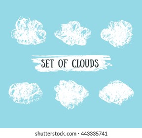 Collection of Hand Drawn Vector grunge Clouds on the blue background.