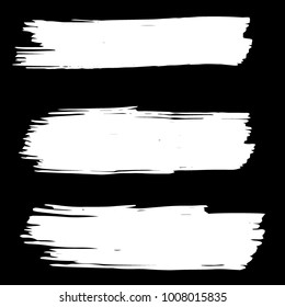 Collection of hand drawn white grunge brushes. Vector Grunge Brushes. Dirty Artistic Design Elements. Creative Design Elements. Banner. Black background with white stripes made with brush.