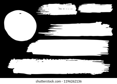 Collection of hand drawn white grunge brushes. Vector Grunge Brushes. Dirty Artistic Design Elements. Creative Design Elements. Black background. Distress Frame, Logo, Banner, Wallpaper.