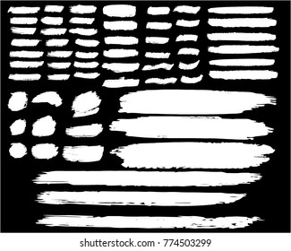 Collection of hand drawn white grunge brushes.  Vector Grunge Brushes. Dirty Artistic Design Elements. Creative Design Elements.  Banner. Black background with white stripes made with brush.