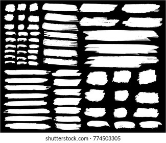 Collection of hand drawn white grunge brushes.  Vector Grunge Brushes. Dirty Artistic Design Elements. Creative Design Elements.  Banner. Black background with white stripes made with brush.