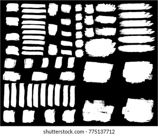 Collection of hand drawn white grunge brushes. Vector Grunge Brushes. Dirty Artistic Design Elements. Creative Design Elements. Banner. Black background with white stripes made with brush.