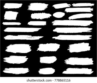 Collection of hand drawn white grunge brushes. Vector Grunge Brushes. Dirty Artistic Design Elements. Creative Design Elements. Banner. Black background with white stripes made with brush.